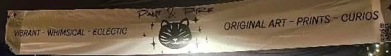 Sara's printed market banner, reading Vibrant Whimsical Eclectic on the left and Original Art Prints Curios on the right, with her cat mark in the middle