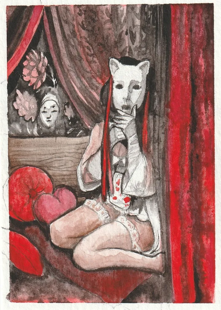 A figure in a white cat mask and lace sitting among red cushions, in front of a heavy red curtain